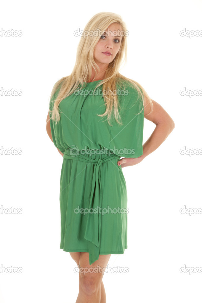 Woman green dress serious looking