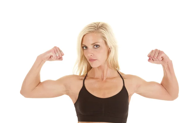 Woman black sports bra flex biceps — Stock Photo, Image