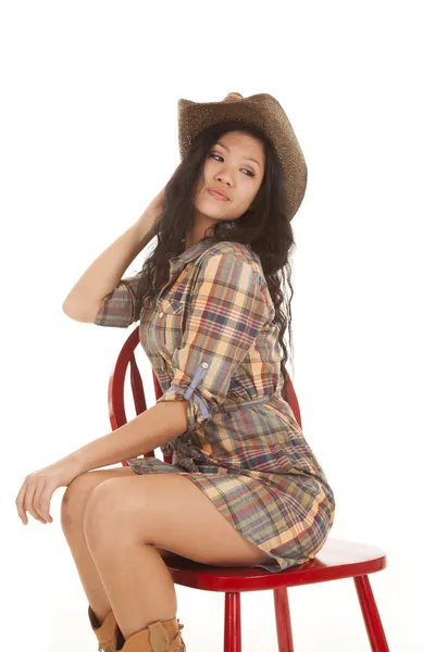 Asian woman plaid hat chair look back — Stock Photo, Image