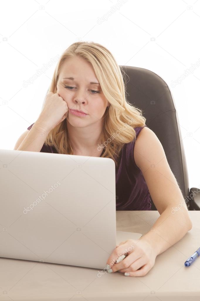 woman computer purple top sad