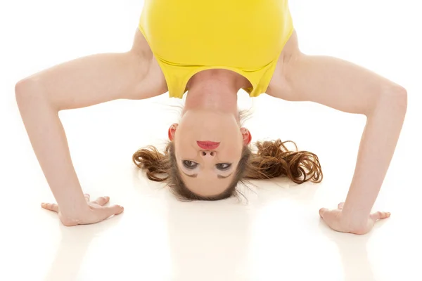 Woman yellow tank head stand — Stock Photo, Image