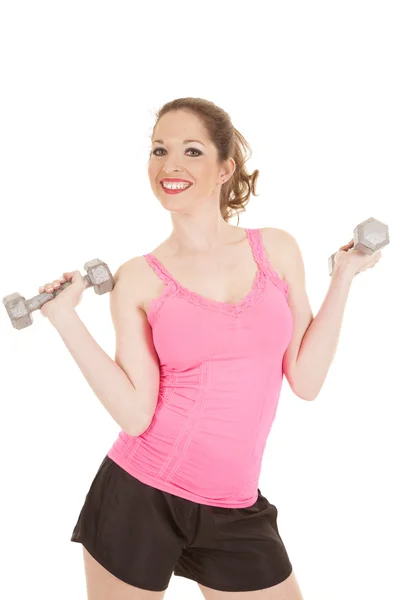 Woman pink tank weights up smile Stock Image