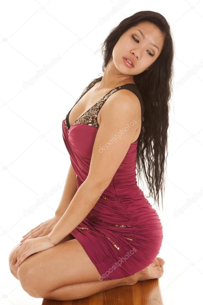 Asian woman kneel red dress