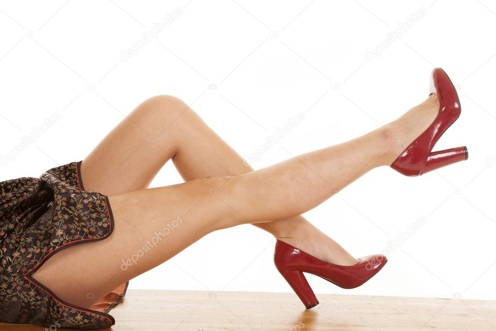 woman legs sit red heals one up