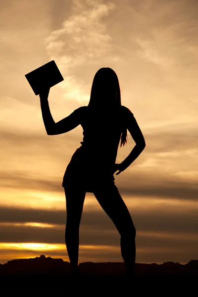 Silueta mujer sostener un libro puesta de sol — Foto de Stock