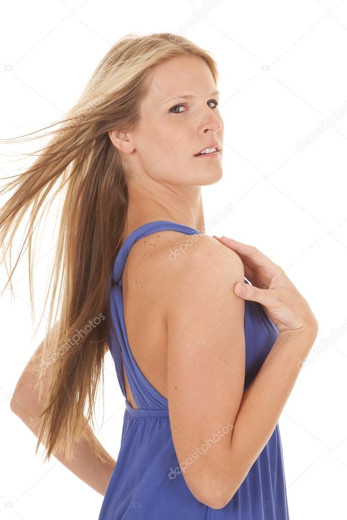 woman blue dress wind side hand shoulder