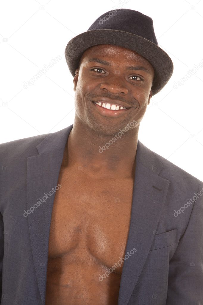 Man in suitcoat no shirt smile