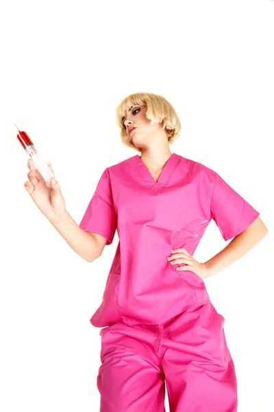 Nurse above hold out shot needle — Stock Photo, Image