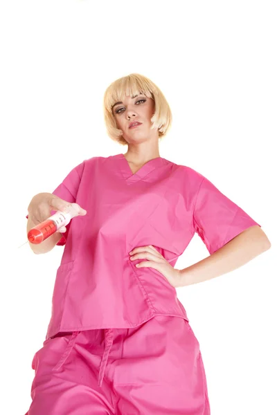 Nurse in pink needle down — Stock Photo, Image