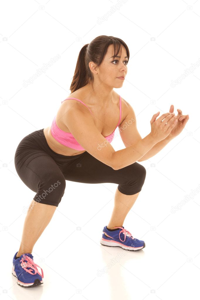 Fitness woman pink sports bra squat