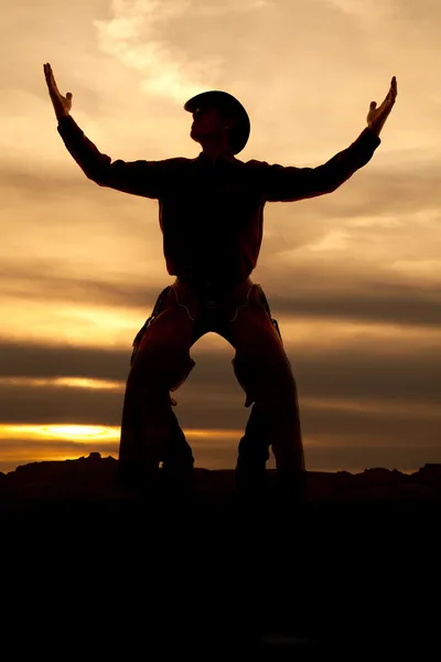 Cowboy stand handen omhoog silhouet — Stockfoto