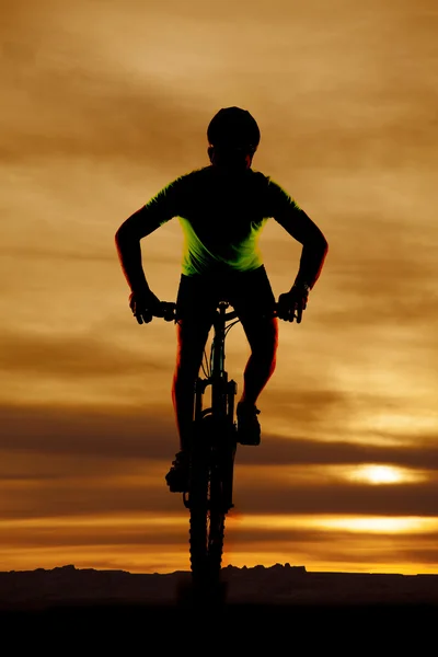Man on bike facing silhouette — Stock Photo, Image