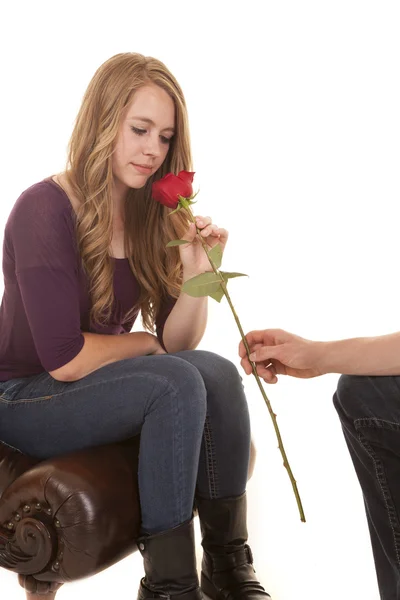 Girl smelling rose guys arm — Stock Photo, Image