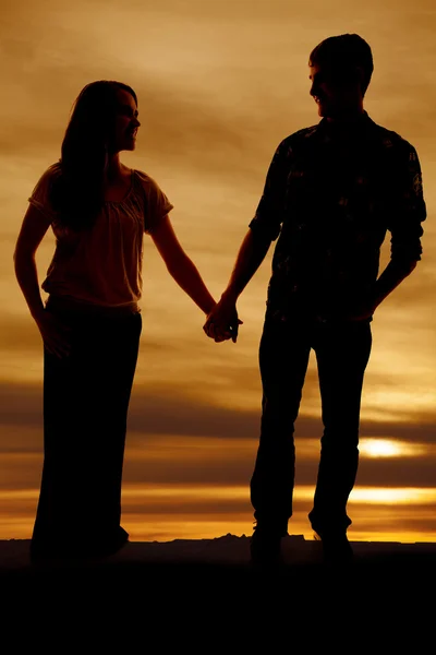 Silhouet van de mens op knie hand vrouw rose — Stockfoto