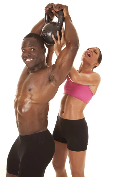 Woman helping man lift weight side her lifting — Stock Photo, Image