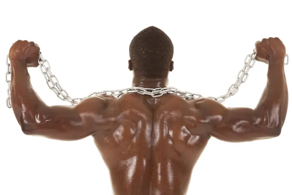 Strong man with chain back flex — Stock Photo, Image