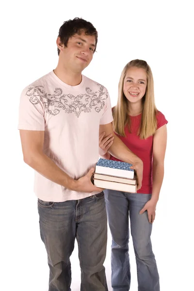 Teen boy holding books of girl — Stock Photo, Image