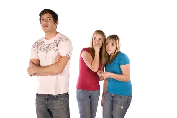 Teen girls wispering about boy — Stock Photo, Image