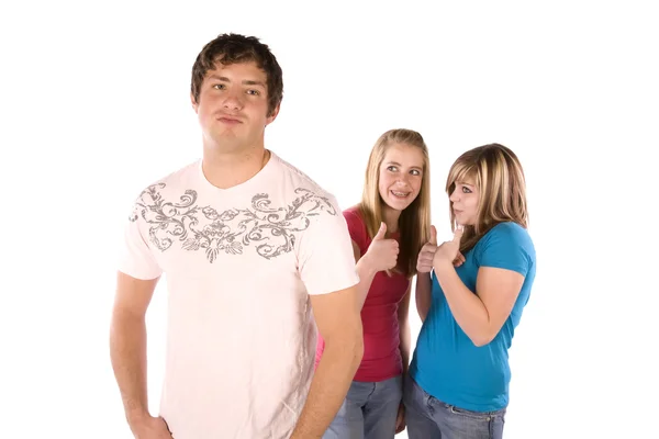 Teen girls wispering about boy — Stock Photo, Image