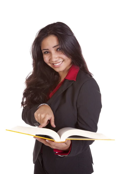 Chica señalando en libro sonriendo —  Fotos de Stock