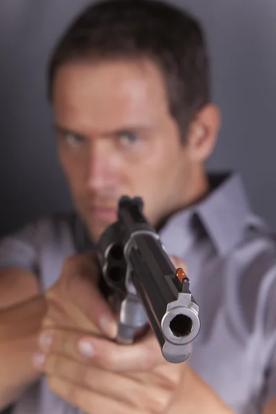 Man pointing gun looks mad — Stock Photo, Image