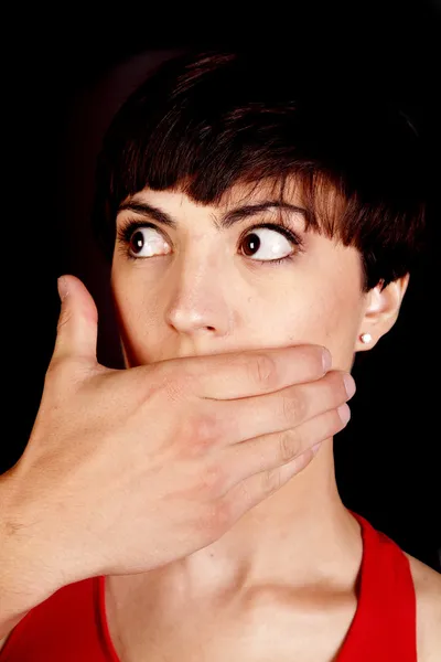 Looking side ways hand over mouth — Stock Photo, Image