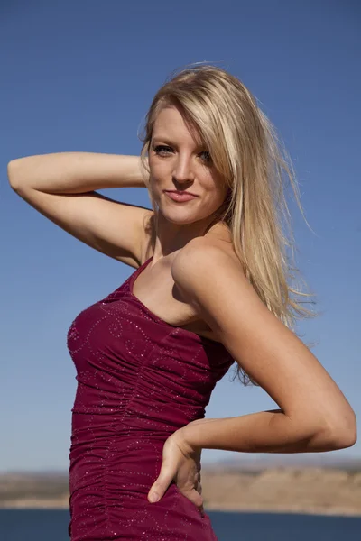 Woman in red dress pose sky — Stock Photo, Image