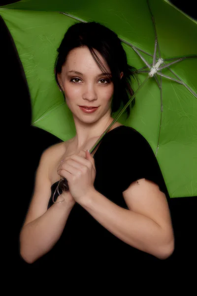 Black with green umbrella looking — Stock Photo, Image