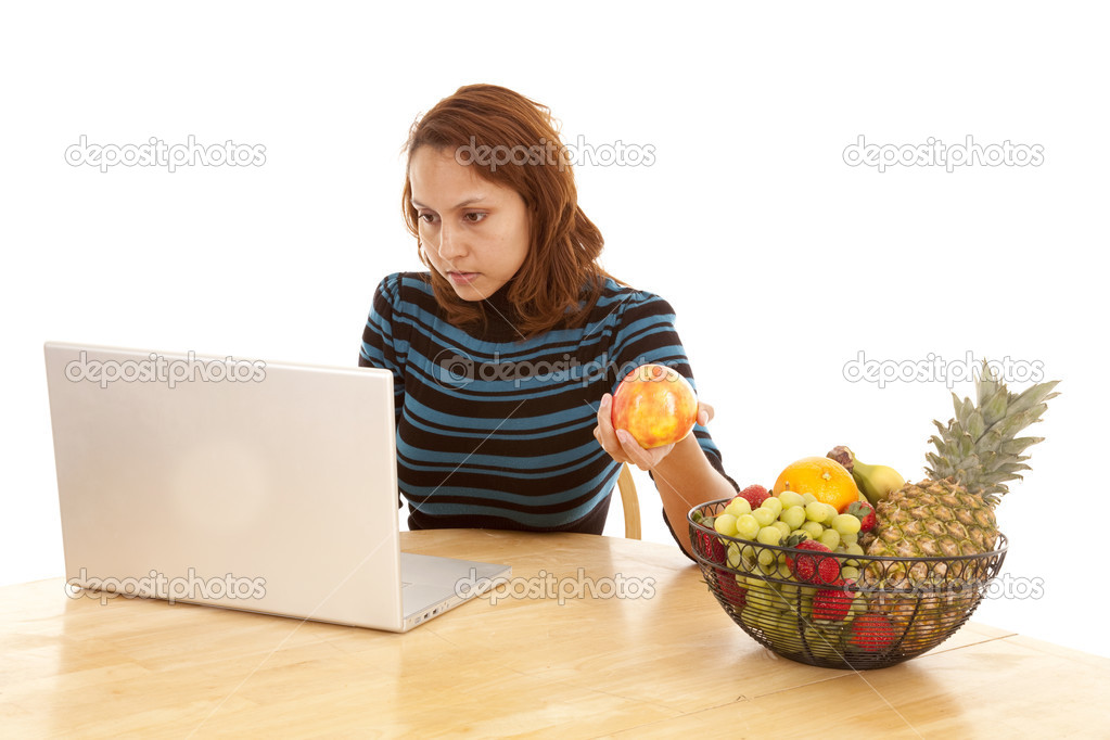 working on computer fruit