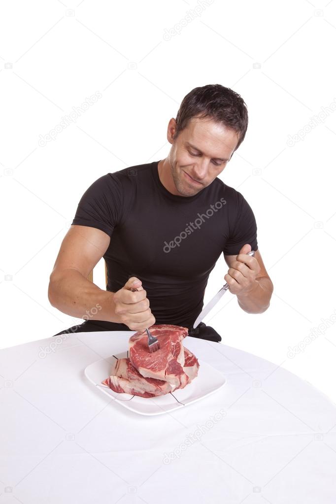 Man with fork in steak