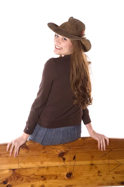 Happy woman on back of bench — Stock Photo, Image