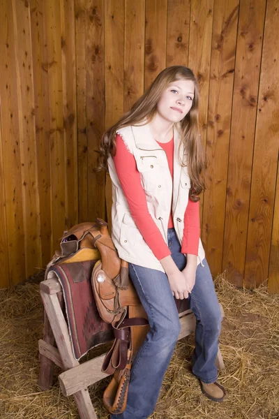 Woman leaning on saddle — Stock Photo, Image