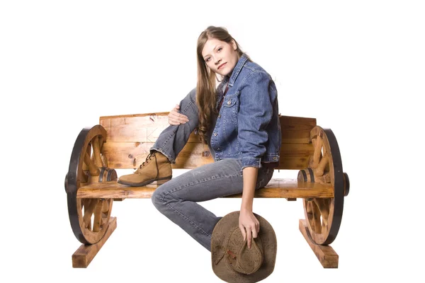 Woman on bench serious hat down — Stock Photo, Image