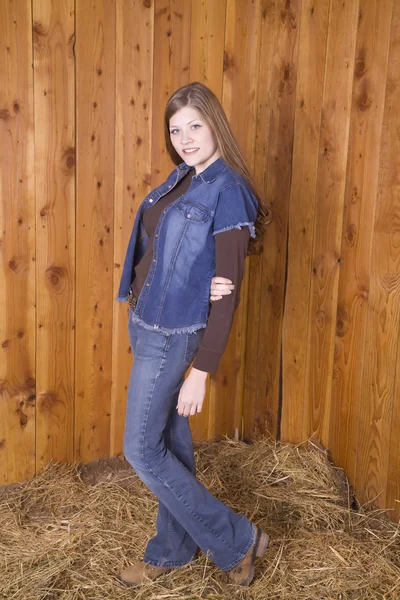 Woman standing in brown shirt smiling — Stock Photo, Image