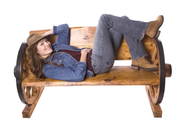 Woman laying on bench smiling — Stock Photo, Image