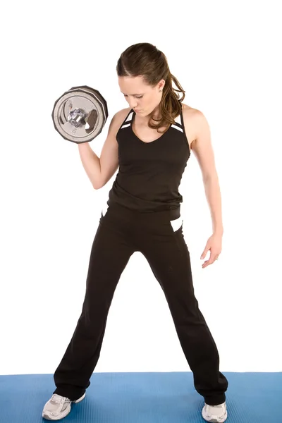 Kadın bir ağırlık kaldırma — Stok fotoğraf