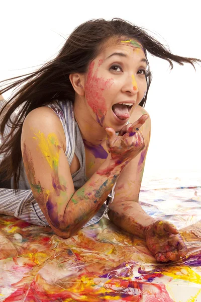 Laying in paint mouth and finger — Stock Photo, Image