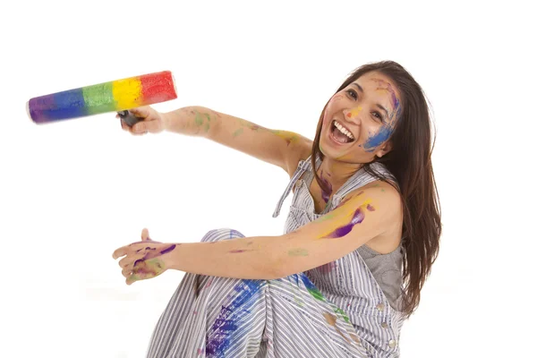 Painting reaching out rainbow roller — Stock Photo, Image