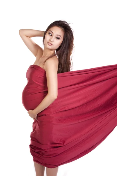 Woman looking back with red cloth — Stock Photo, Image