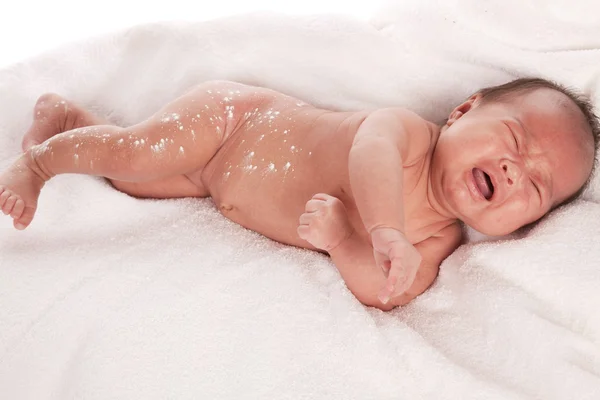 Bambino che posa in un asciugamano — Foto Stock
