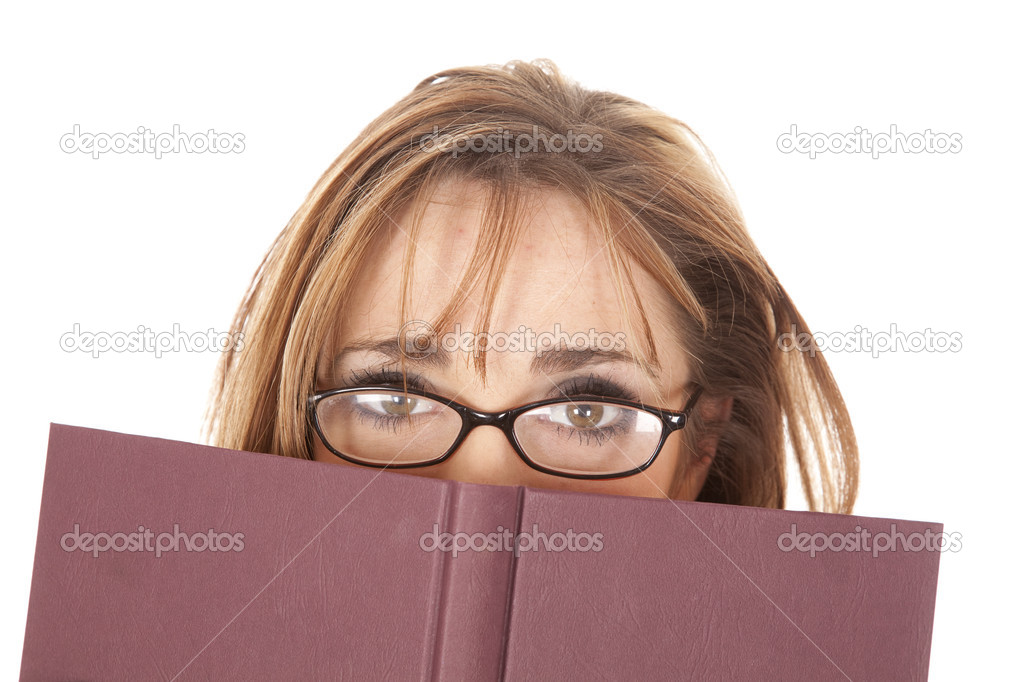 woman glasses looking over book