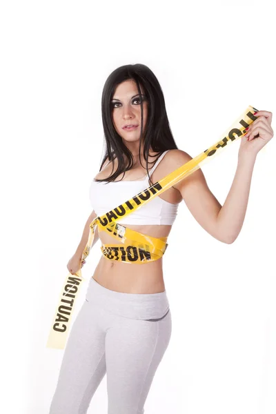 Woman sports bra caution tape — Stock Photo, Image