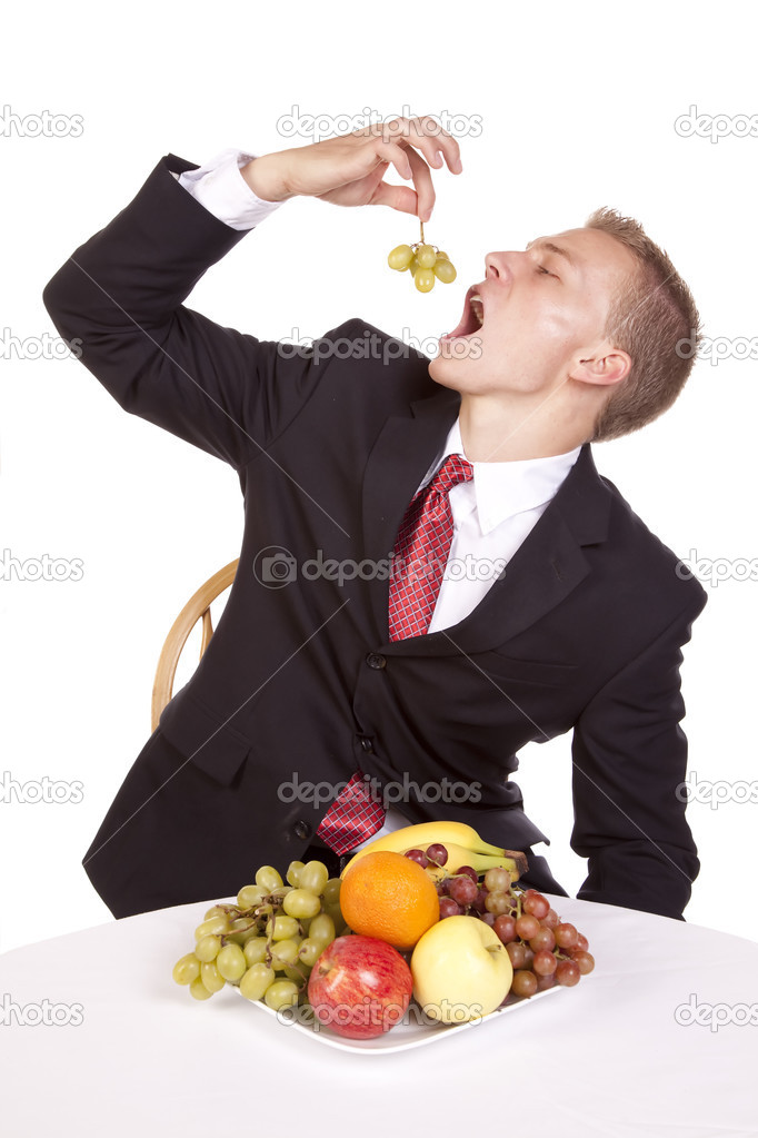 placing grapes in mouth