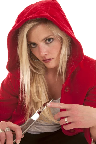 Woman red hoody touch knife — Stock Photo, Image