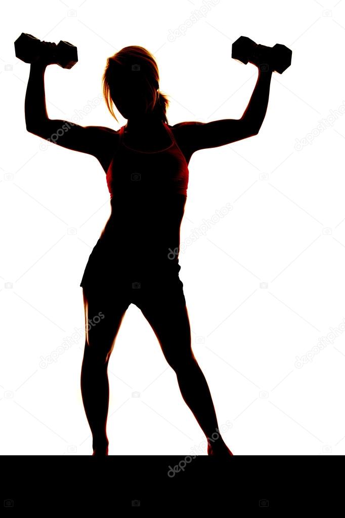 Stock photography ▻ A woman is lifting weights up in the air silhouetted ◅ ...