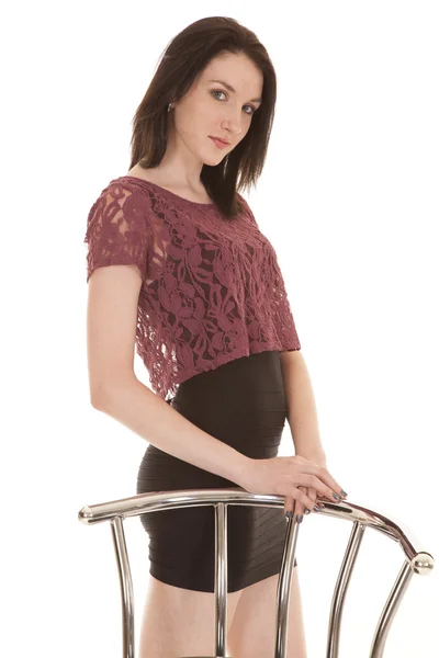 Woman lace top stand by chair — Stock Photo, Image