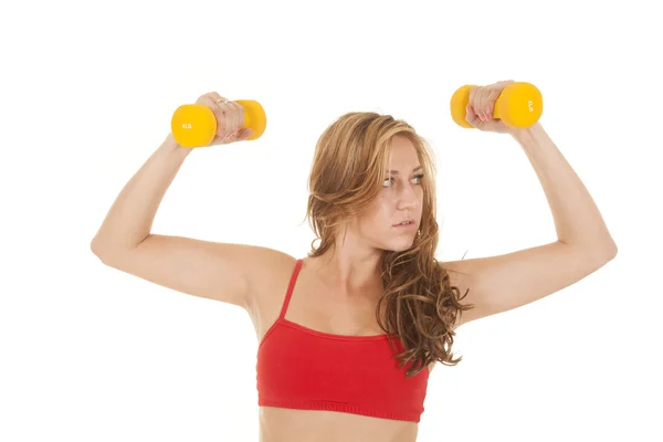 Woman red sports bra yellow weights flex — Stock Photo, Image