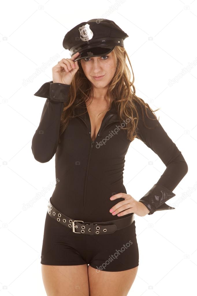 Female cop hand on hat looking