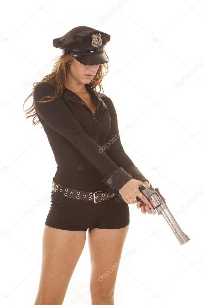 Female cop pointing gun down