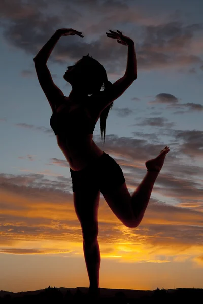 Silhouette woman fitness dance leg up — Stock Photo, Image